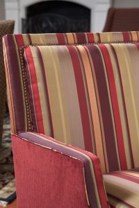Close up of striped upholstery arm chair